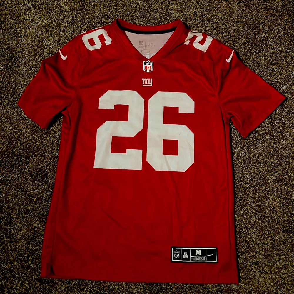 Red nike Saquon Barkley jersey.